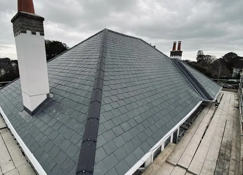 Re-slated hipped roof with lead ridge detail