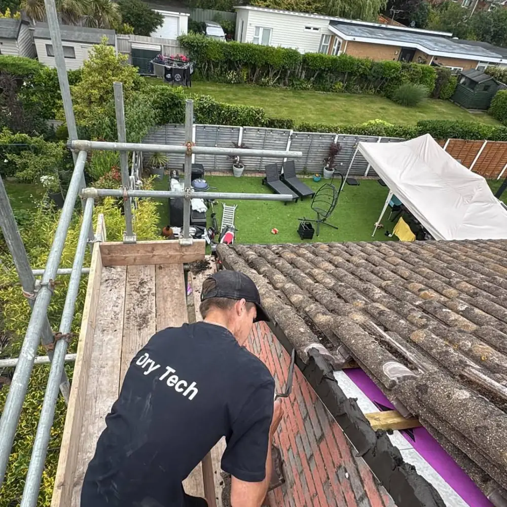 Drytech roofer repointing a ridge tile