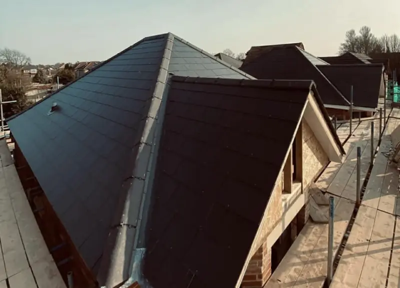 Dark tiled roof on a new-build property