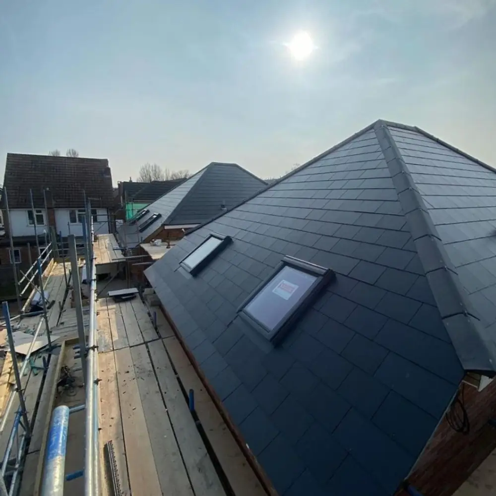 New slate hipped roof with skylights